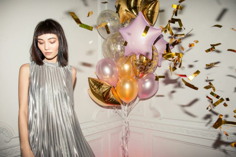 woman wearing pleated silver dress